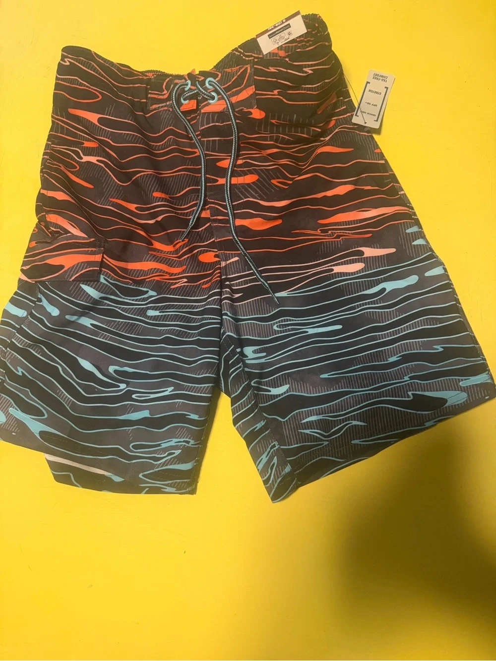 Men's size small nwtBlack Swim Trunks with Red & Teal Wave Print